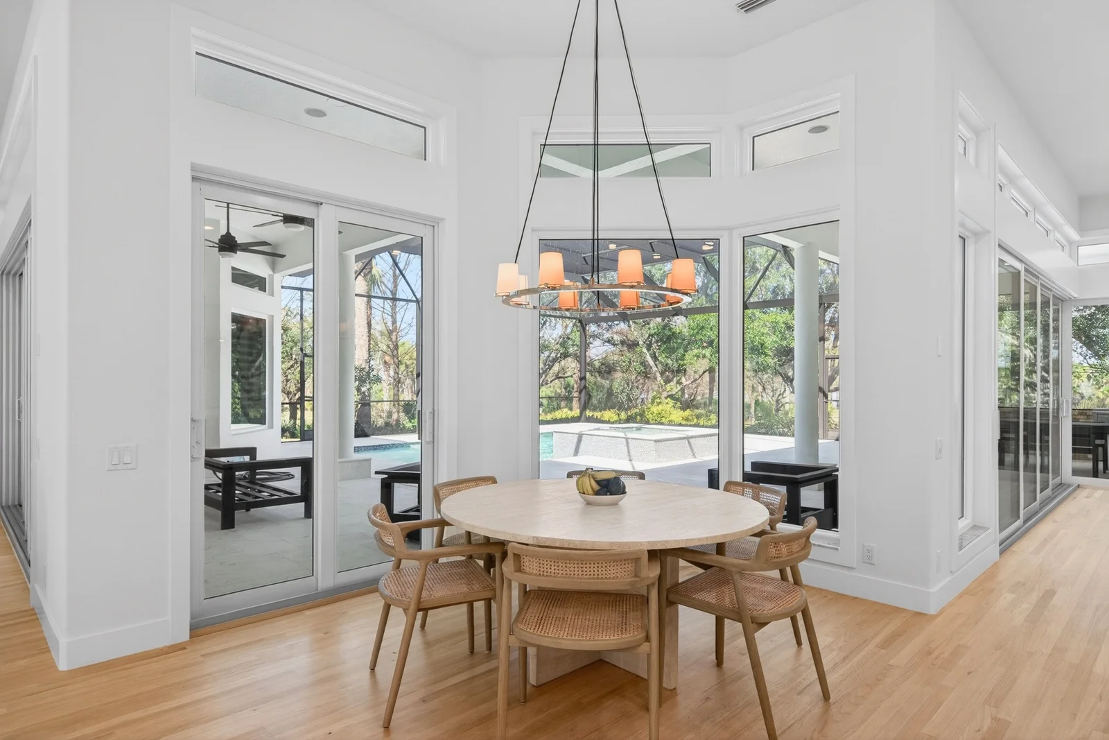 Gallery 16 Breakfast nook with round table and pool view in Venice FL home remodel