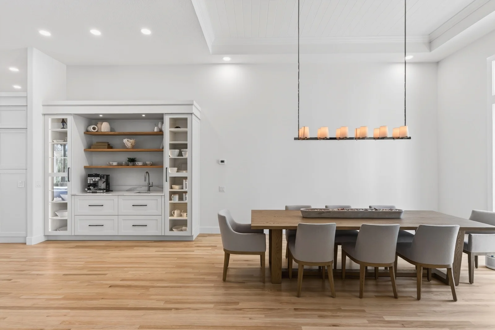 Gallery 9 Dining room with built-in coffee bar and linear chandelier in Venice FL