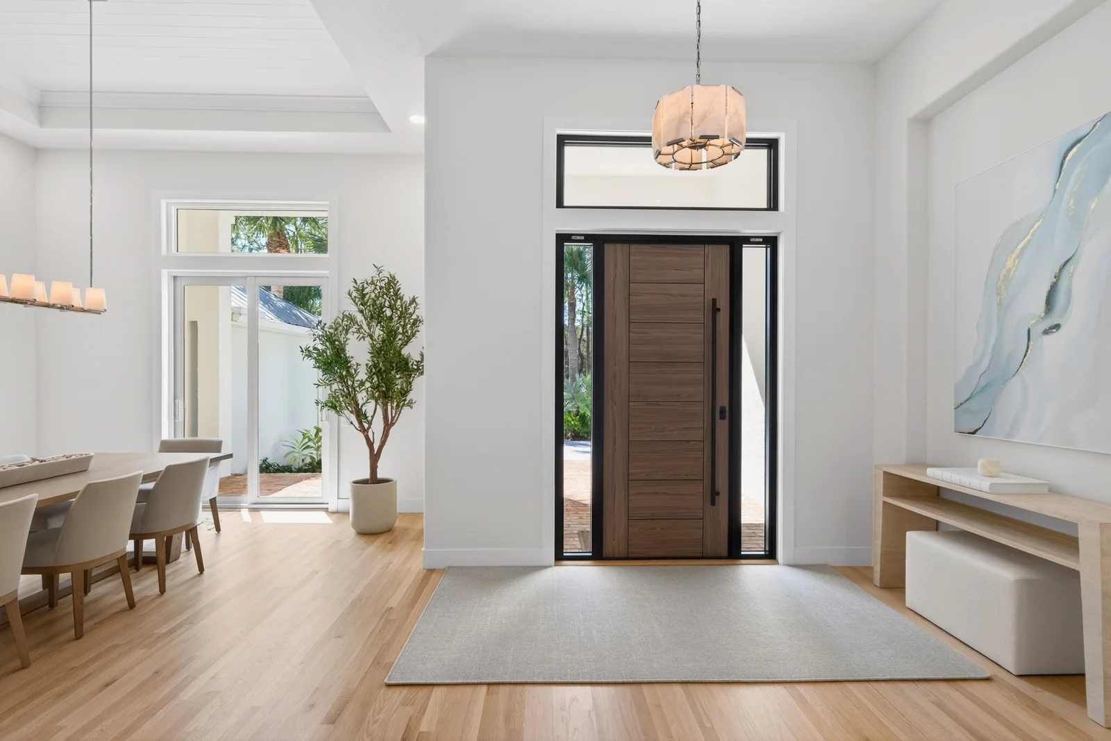 Gallery 8 Open foyer with wood door tray ceiling and dining beyond in Venice remodel