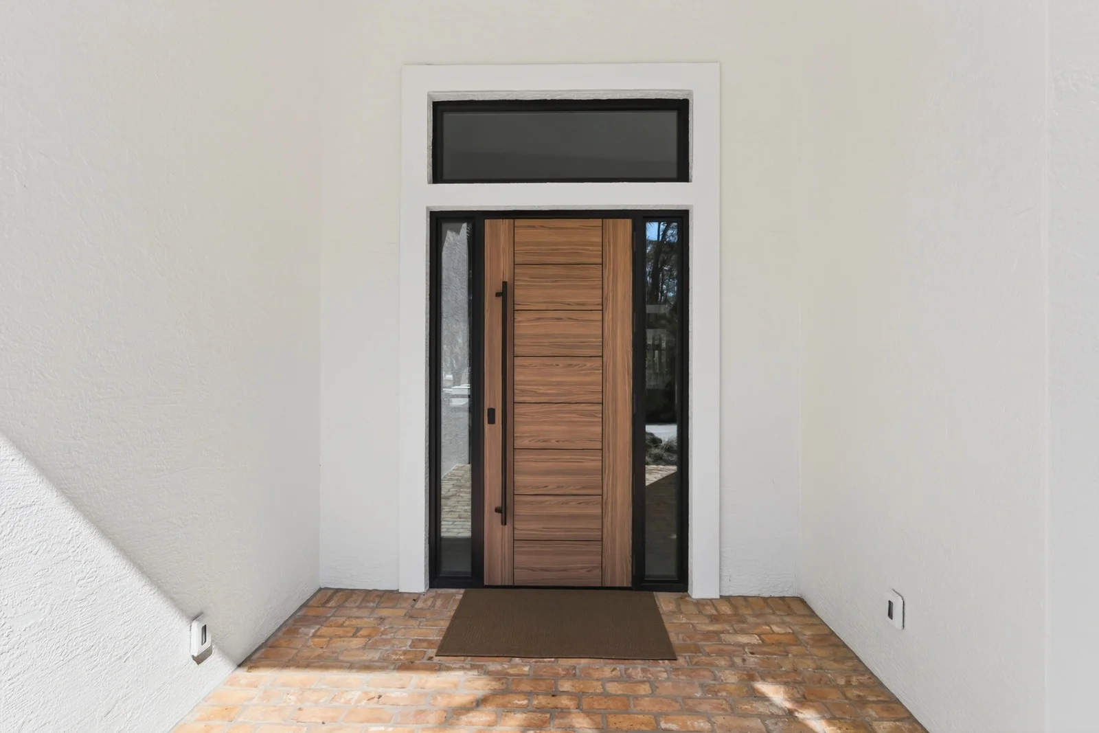 Gallery 6 Modern wood front door with brick paver entry in Venice home remodel