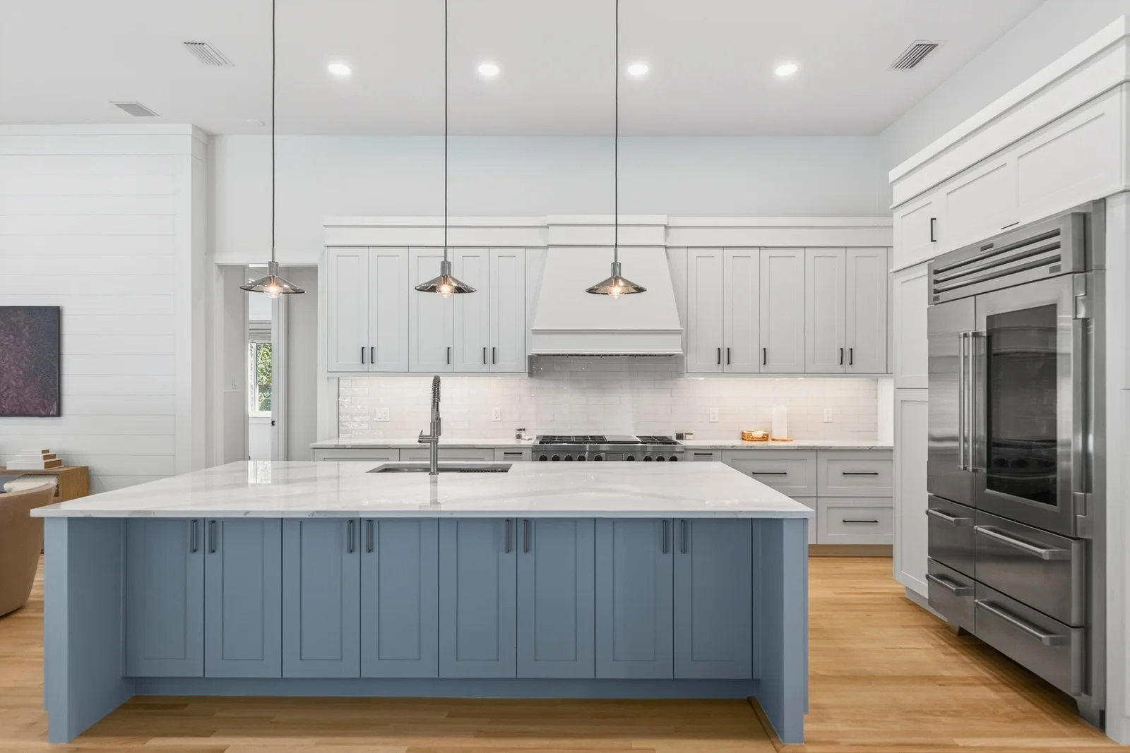 Kitchen with blue island marble countertops and gas range in Venice FL