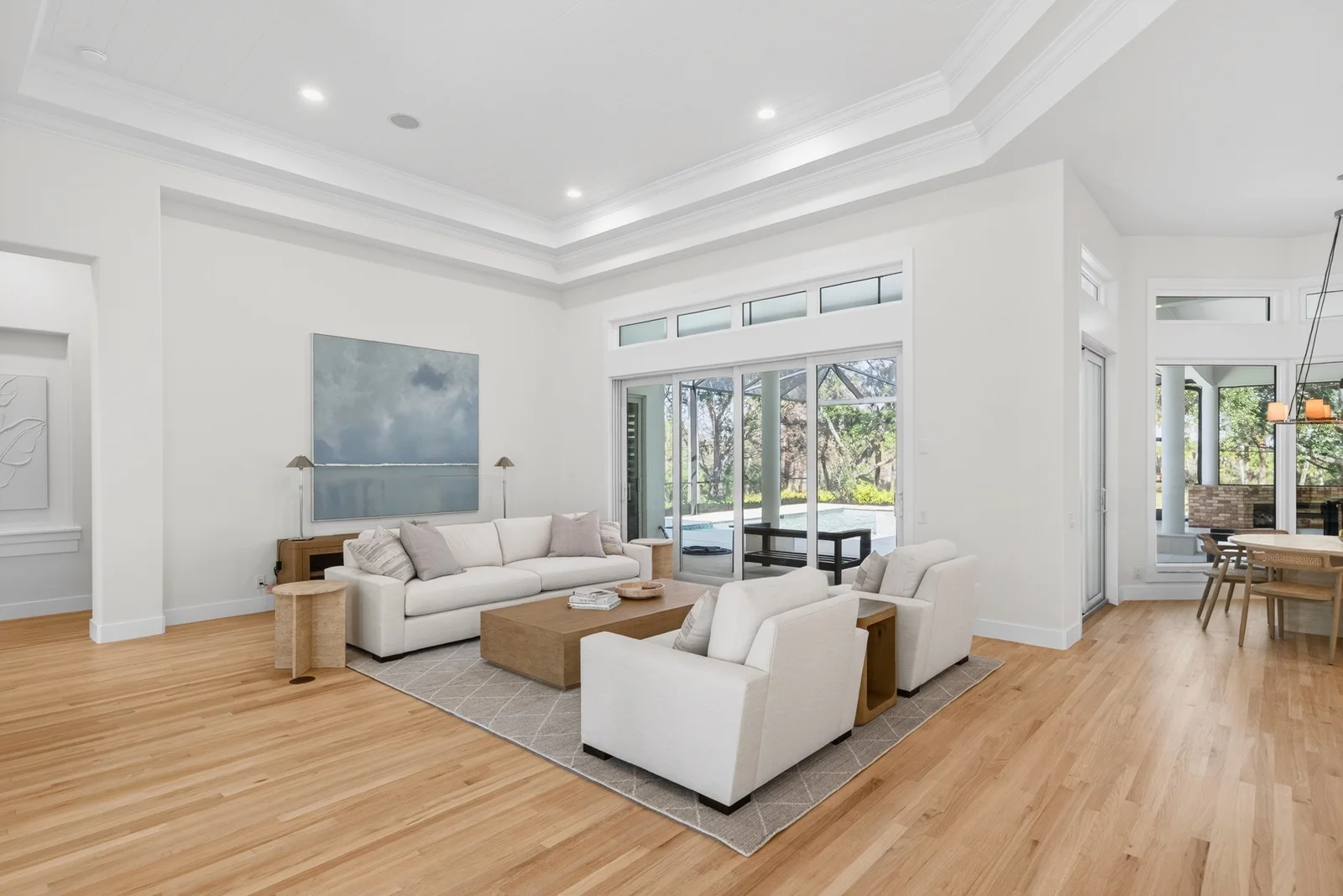 Gallery 14 Living room with sliding doors to lanai pool in Venice home remodel
